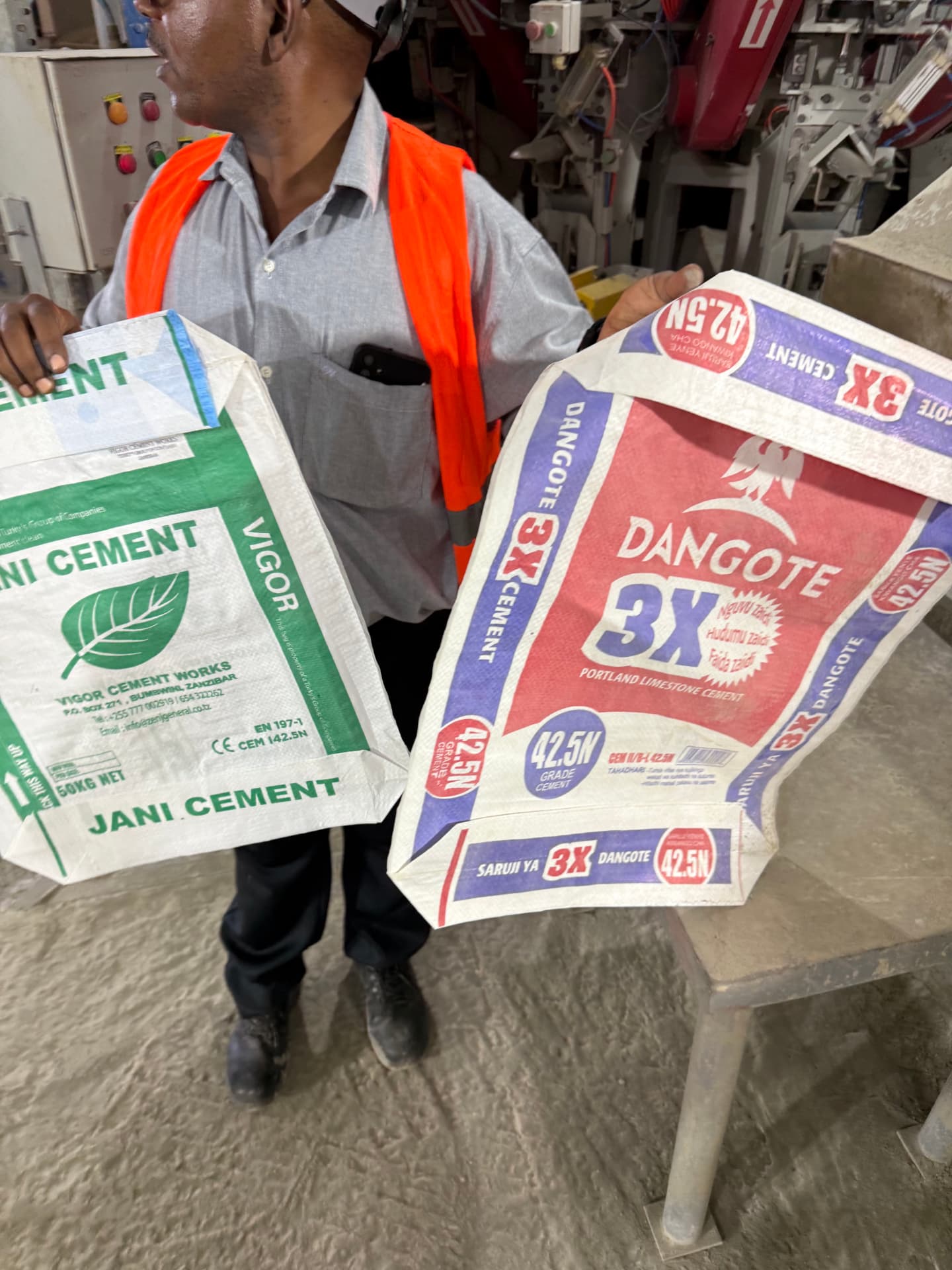 Bagged cement stacked under cover ready for delivery in Zanzibar